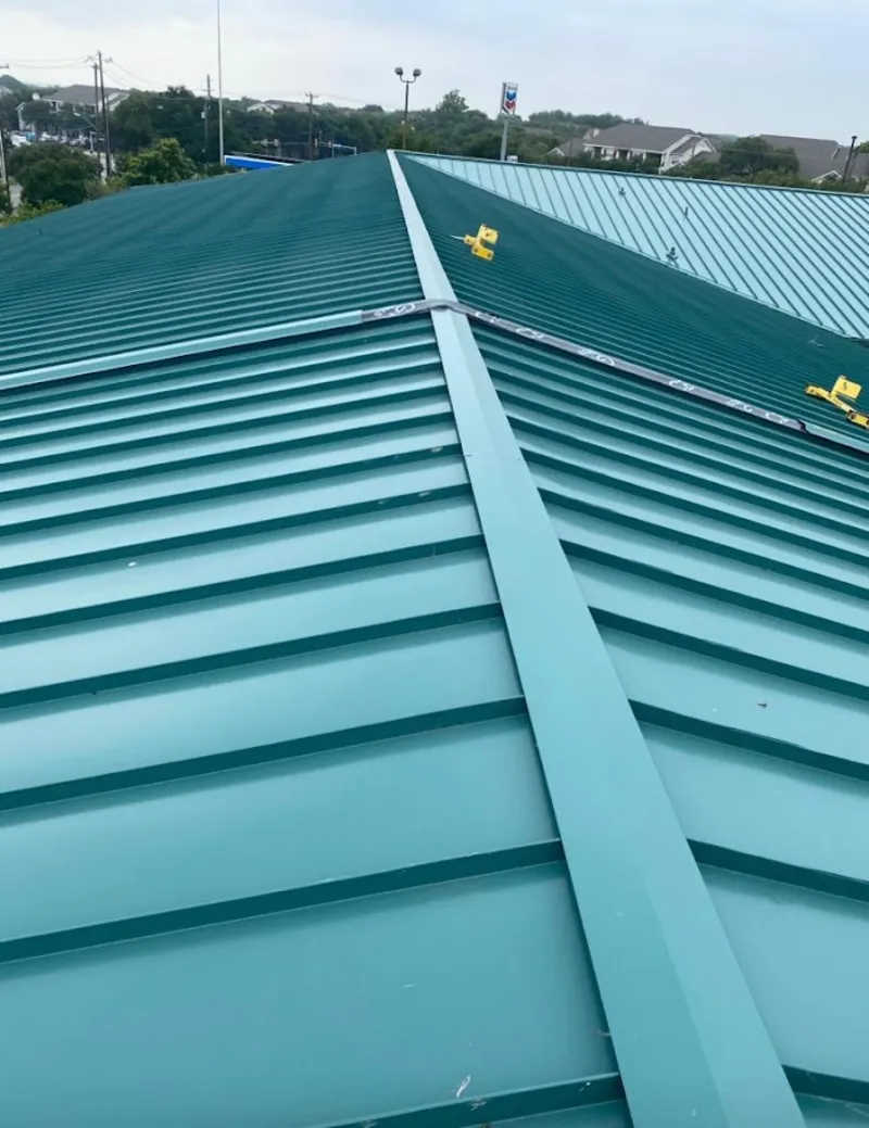 Green commercial metal roof ridge and valley for Metal Roof Repair in North Oaks